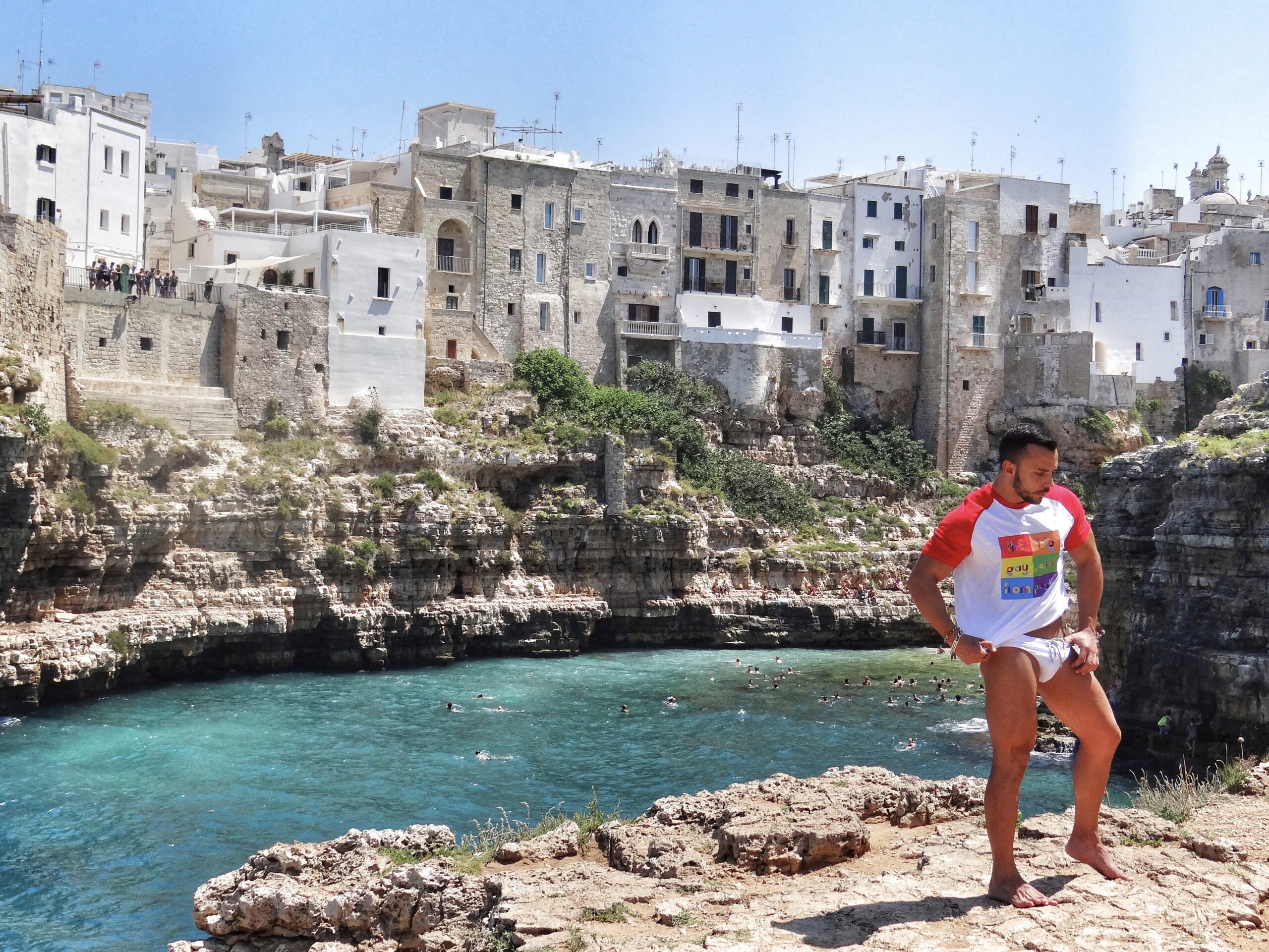 Polignano a Mare has one of Puglia’s most iconic views. Puglia is Italy’s top gay summer destination for LGBT travel with a variety of gay and nudist beaches, gay bars and clubs and a chilled gay scene. Photo by the Puglia Guys for The Big Gay Podcast from Puglia.