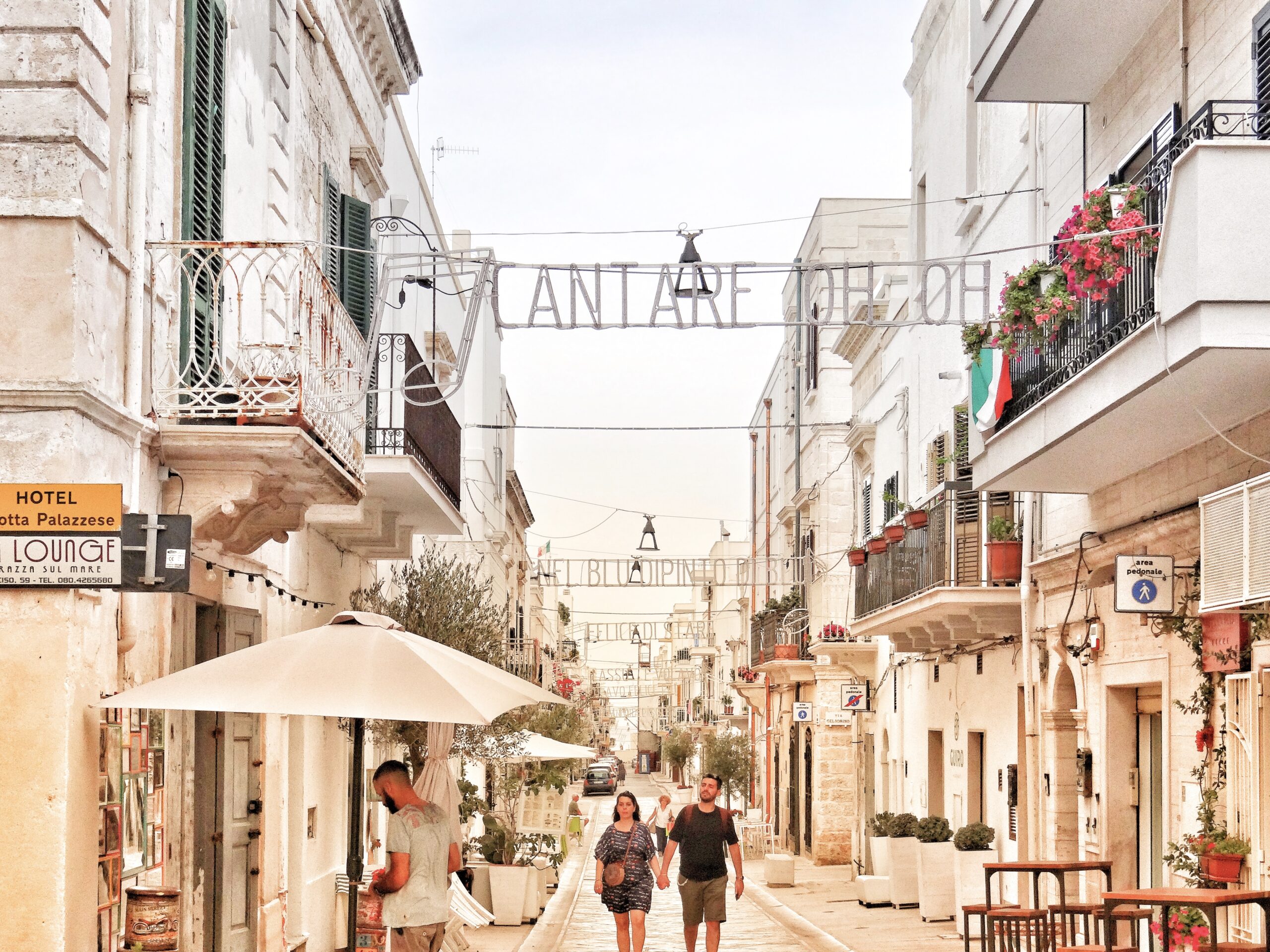 Polignano a Mare, Puglia. Volare lighting decorations. Photo the Big Gay Podcast from Puglia.