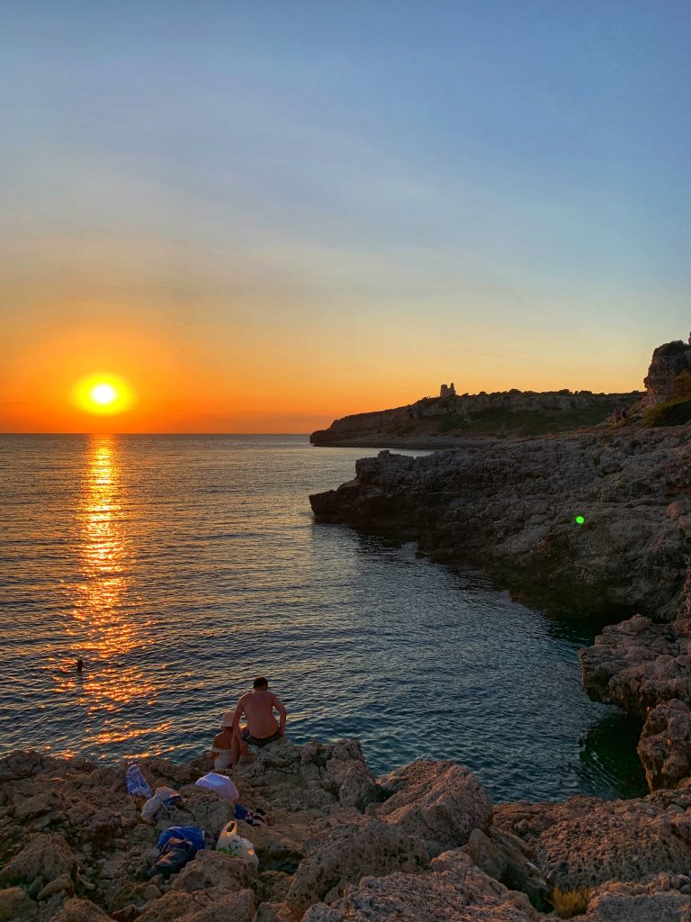 Porto Selvaggio gay beach, situated in a nature reserve, is a popular local beach with rocks | Photo © the Puglia Guys for the Big Gay Podcast from Puglia guides to gay Puglia, Italy’s top gay summer destination