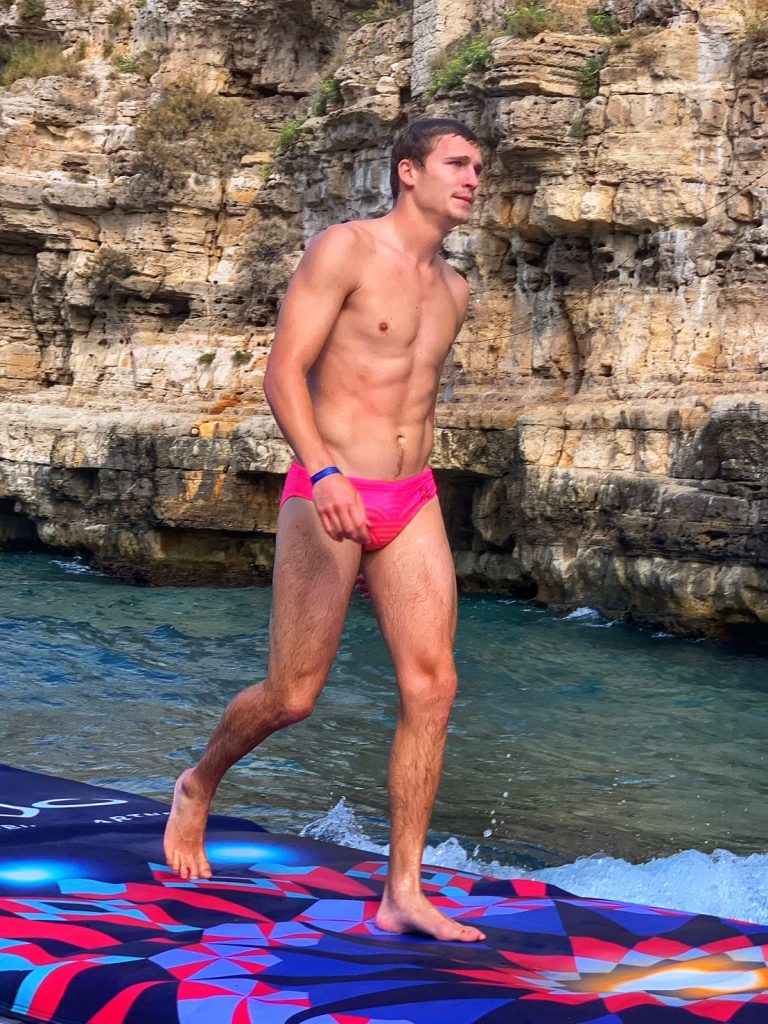 Owen Weymouth one of the UK cliff divers in the 2021 Red Bull Cliff Diving Series. The 2021 final at Polignano a Mare, Puglia. Photo the Puglia Guys for The Big Gay Podcast from Puglia.