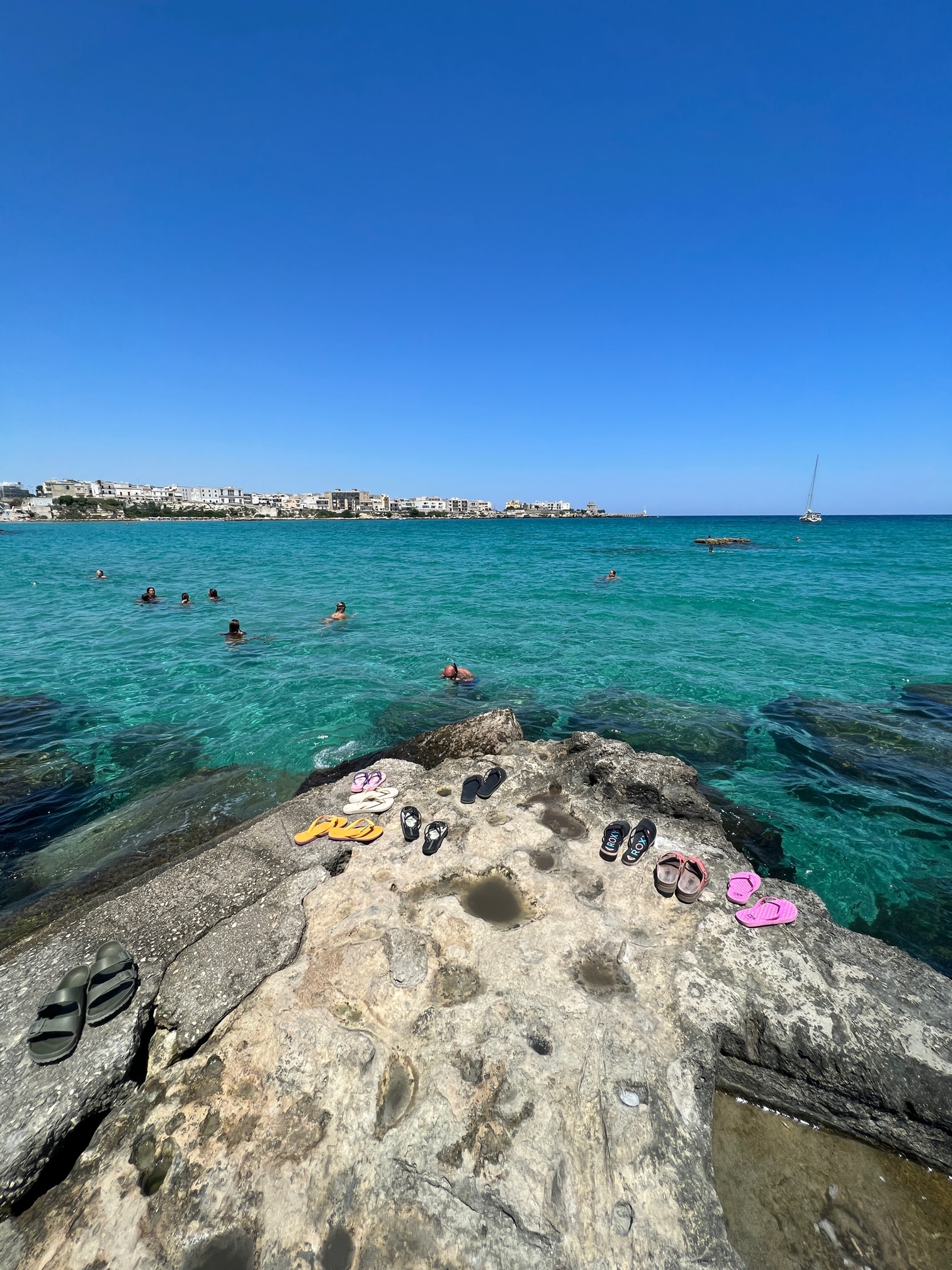 The azure blue sea at Porto Otranto, Salento. Photo by The Big Gay Podcast from Puglia. Inclusive and gay travel guides to Puglia, Italy. 