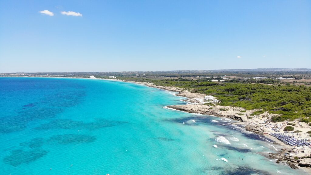 Punta della Suina refers to the larger area extending from the lido and bar, to Spiaggia degli Innamorati and includes the gay and nudist beach. Gallipoli. Photo copyright © The Puglia Guys for the Big Gay Podcast from Puglia. Punta della Suina is Italy’s top gay beach.