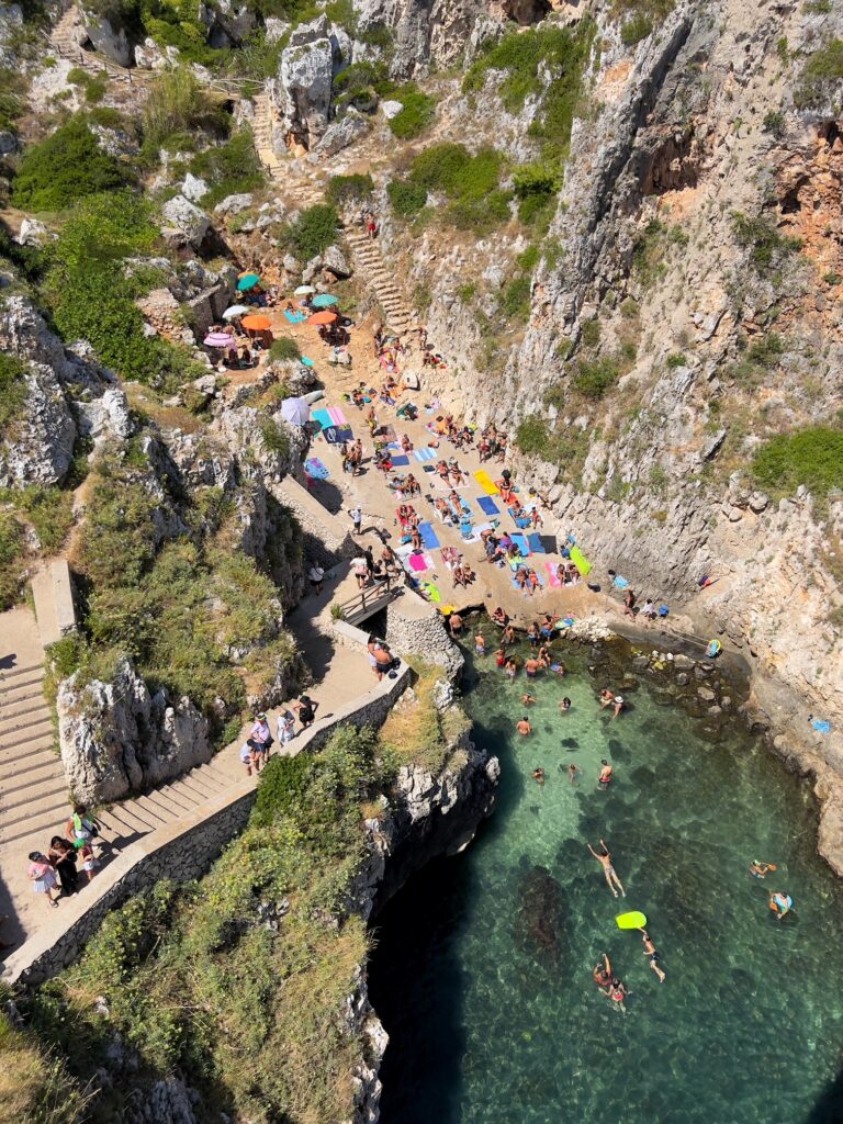 Il Ciolo, Gagliano del Capo - one of Puglia’s most beautiful swimming spots, in a dramatic canyon underneath a bridge | Photo © the Puglia Guys for the Big Gay Podcast from Puglia guides to gay Puglia, Italy’s top gay summer destination