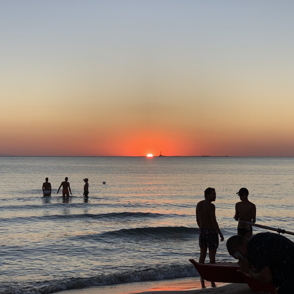 Sunset at Por do Sol, Baia Verde, Gallipoli. One of Puglia’s best gay beaches. Gallipoli has a well known reputation for being one of Italy’s top gay destinations, drawing a cosmopolitan and sophisticated international gay crowd. Photo © the Puglia Guys for the Big Gay Podcast from Puglia gay travel guide.