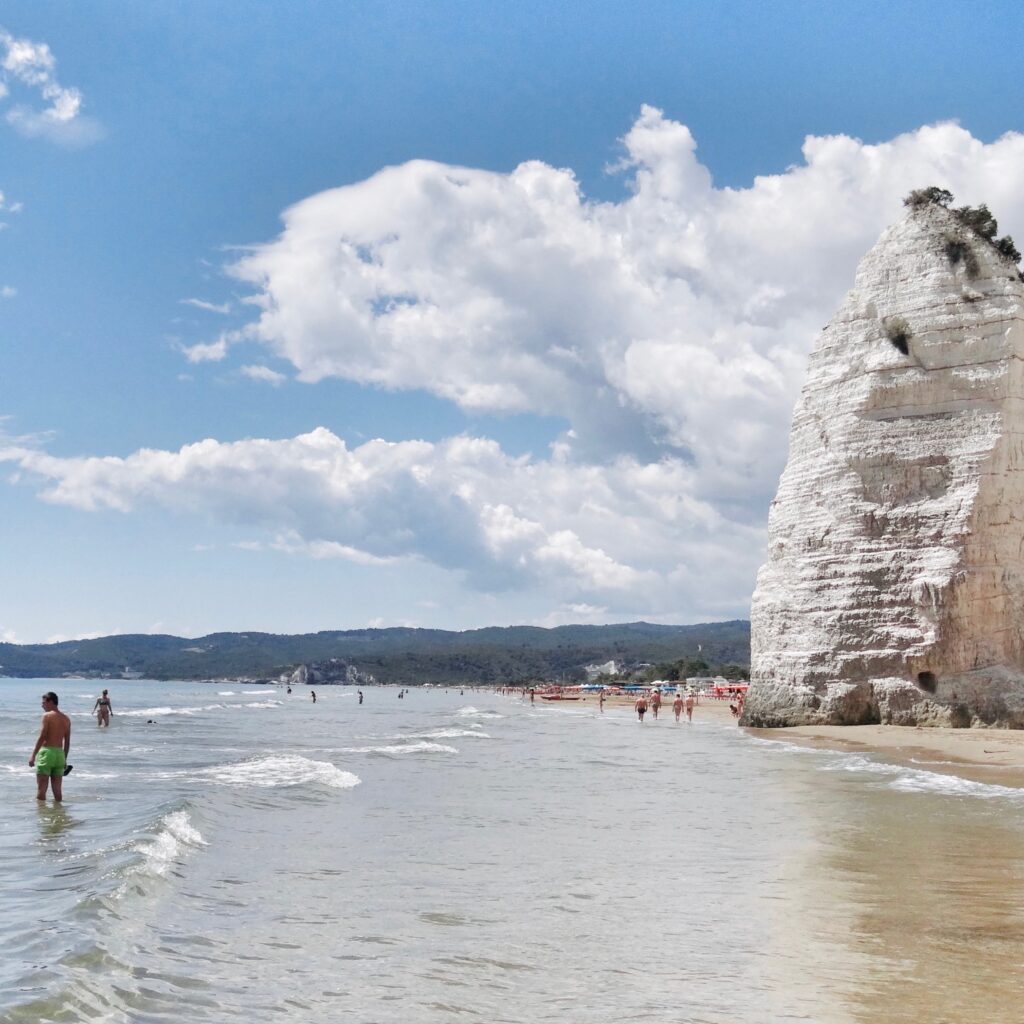 Spiaggia del Castello or Scialara or sometimes Pizzomunno beach, Vieste | Photo © the Puglia Guys for the Big Gay Podcast from Puglia guides to gay Puglia, Italy’s top gay summer destination | Puglia by beach guide to Puglia’s best beaches | Gargano beach