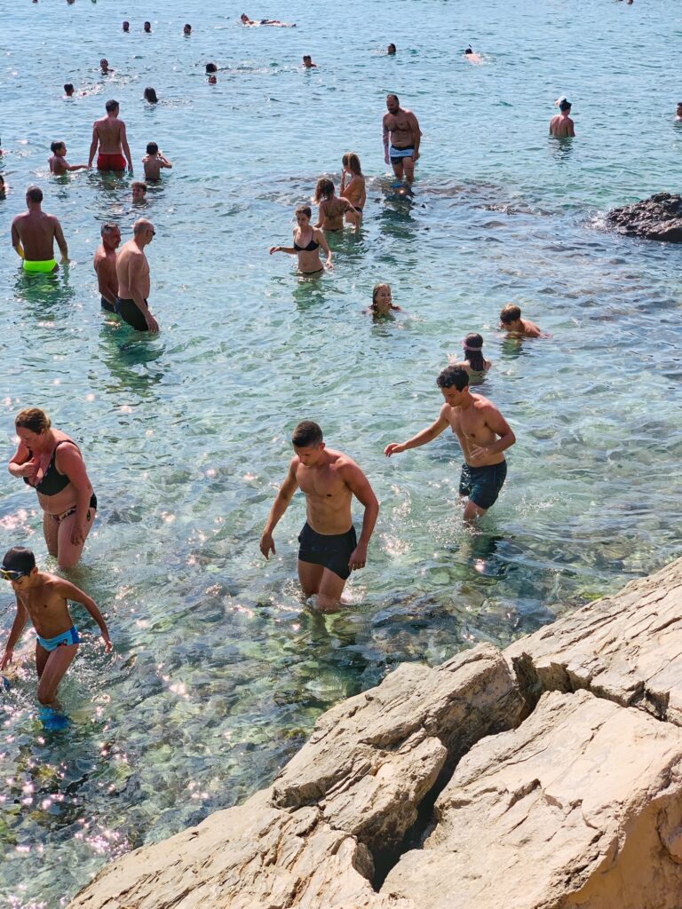 Porto Selvaggio, situated in a nature reserve, is a popular local beach with rocks | Photo © the Puglia Guys for the Big Gay Podcast from Puglia guides to gay Puglia, Italy’s top gay summer destination