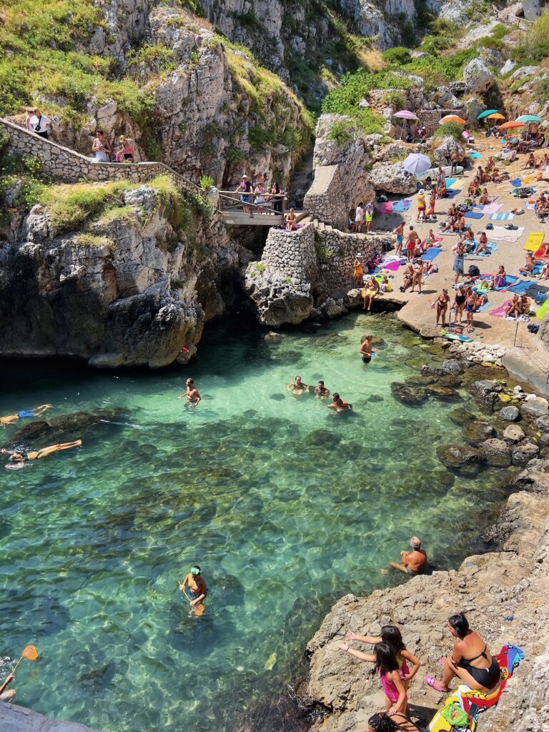 Il Ciolo, Gagliano del Capo - one of Puglia’s most beautiful swimming spots, in a dramatic canyon underneath a bridge | Photo © the Puglia Guys for the Big Gay Podcast from Puglia guides to gay Puglia, Italy’s top gay summer destination