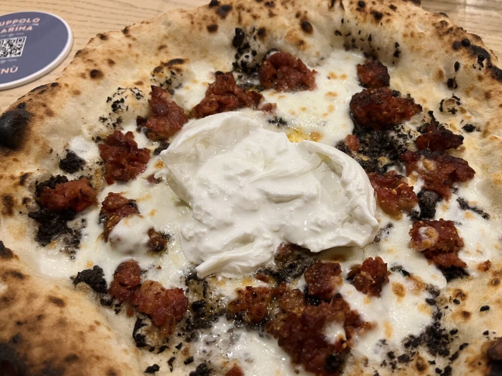 Pizza from Luppolo & Farina pizzeria in Latiano, Puglia, one of Italy’s top 50 pizzerias according to Italian food journalist Luciano Pignataro | photo the Puglia Guys for the Big Gay Podcast from Puglia travel guides to Italy’s top gay summer destination for LGBTQ travel.