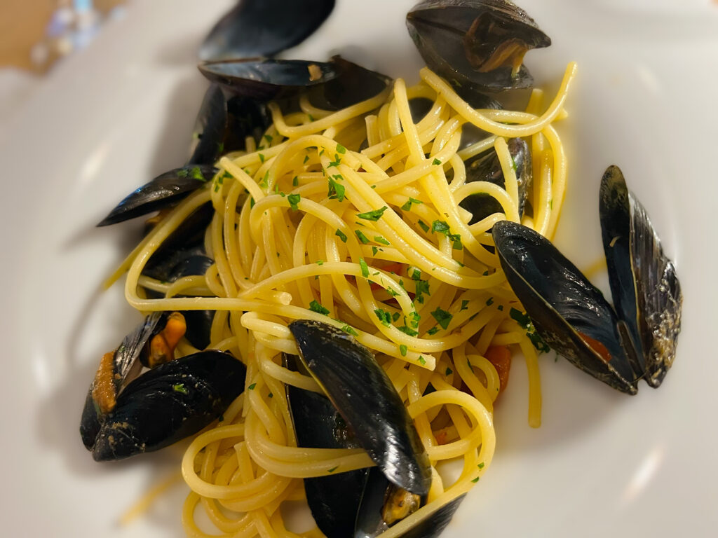 Some Northern European visitors were at a table next to us. One had ordered spaghetti alle cozze (with mussels). The lady asked for some grated cheese for her pasta. The very pleasant and polite waiter simply said no, before going about his business, explaining: “We don’t have cheese with seafood pasta”. The lady agreed and ate her pasta without grated cheese.