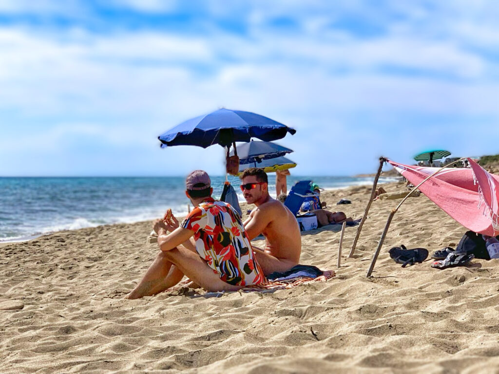 boyfriends on D’Ayala Beach, Campomarino di Maruggio one of Puglia’s top 3 big gay beaches. Photo copyright the Puglia Guys.
