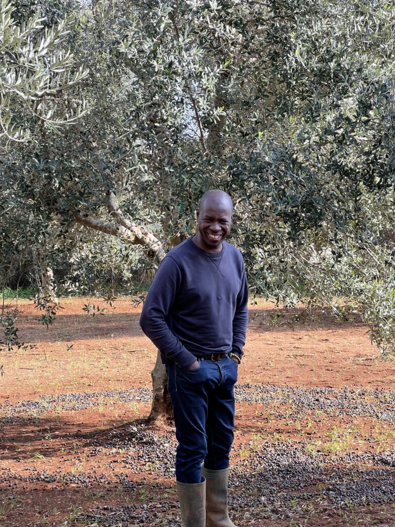 BBC TV presenter Clive Myrie in the olive grove in the Puglia episode of Clive Myries’s Italian Road Trip for BBC TV. Photo by the Puglia Guys.